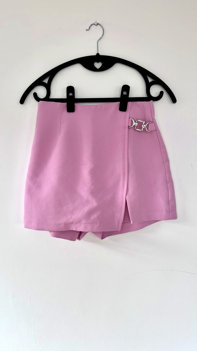 Dusky pink wrap-style skort with silver chain clip hardware